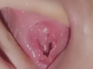 Toying with her moist pussy