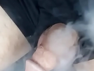 Blowing meth smoke at his cock