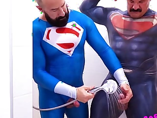Superheroes washing their jizz off each every other