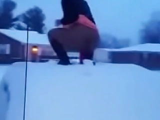 Superb captured girl fucking a dildo on a car roof in someone's skin snow