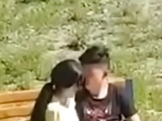 Oriental couple filmed with the public park