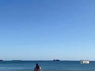 Lady WALKING ON Someone's skin BEACH