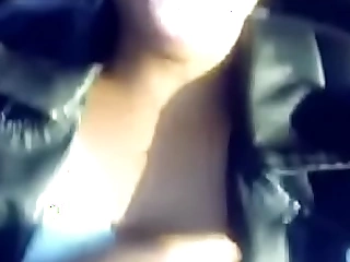 Ebony demonstrating boobs and pussy in the motor