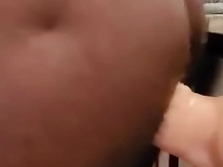 Thick black ass riding a huge fake penis