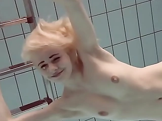 Blonde babe Okuneva shaved pussy undersea swimming
