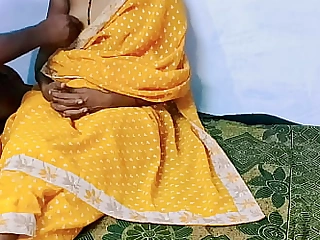 Yellow color sary in dispirited Desi wife