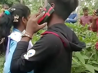 Teenage girl pounding outdoor caught by villagers