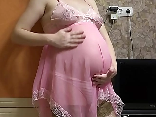 Pregnant milf fucks with dildo through panties and shakes inexperienced tits.